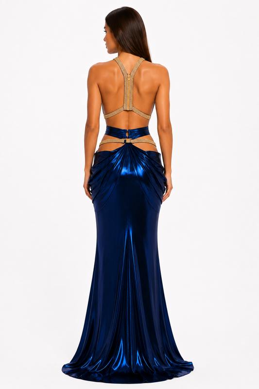 Back view of the CJ Dress two-piece halter gown showing crystal-trimmed halter straps, an open back, cutout waist, gathered hips, and a floor-length train.