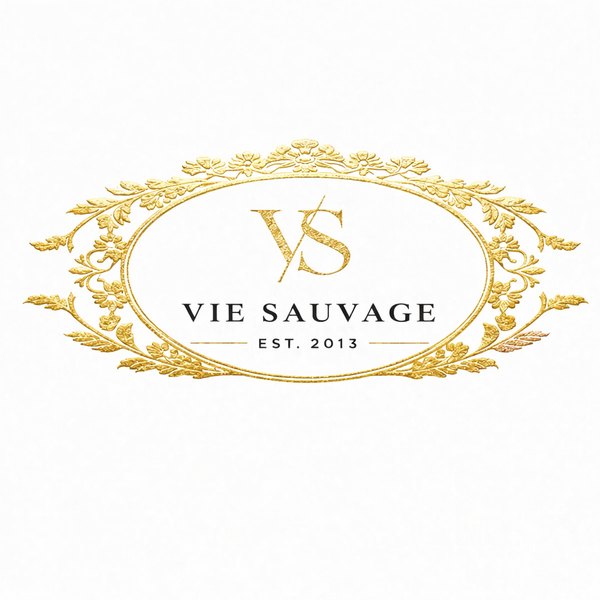 Vie Sauvage logo with ornate gold design on a white background