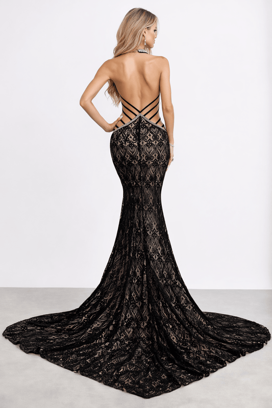 Back view showing open strappy back and long lace train. Jennifer Halter gown - Vie Sauvage